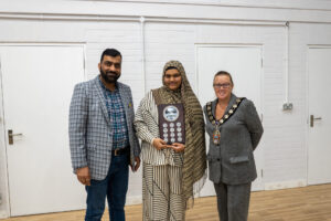 Mayor Siobhan Dauti presents Safa with the Christine Boom Memorial Award.